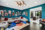 Spacious Family Room Features U-Shaped Sofa & 75 Inch TV